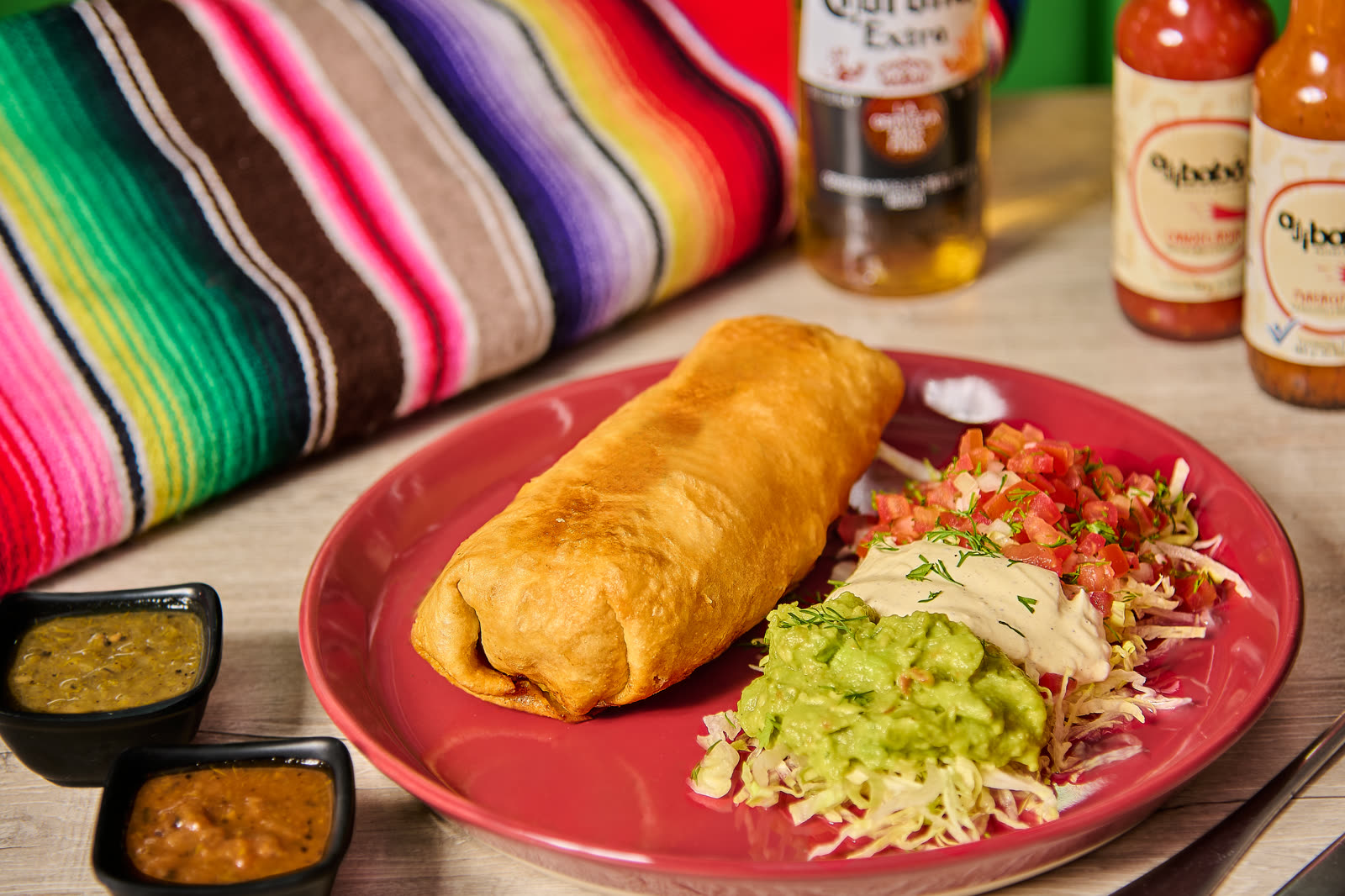 Fried chimichanga stuffed with beef, cheese and veggies